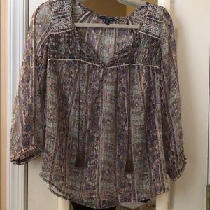 Bohemian style blouse with quarter sleeves.